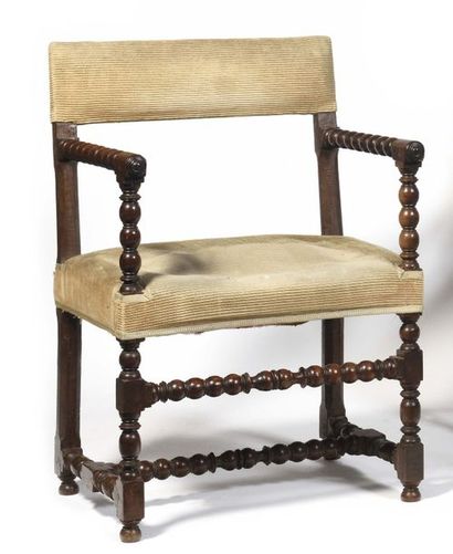 null Chair with turned walnut arms, the backrest resting on a spacer base, (restorations,...