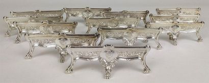 null Continuation of TWELVE KNIFE HOLDER in silver chiselled with foliage resting...