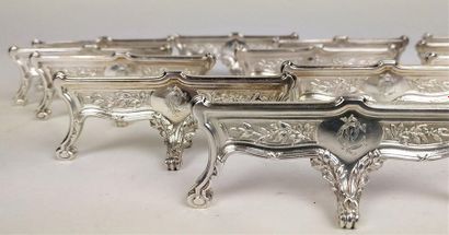 null Continuation of TWELVE KNIFE HOLDER in silver chiselled with foliage resting...