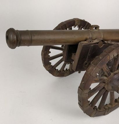 null ARTILLERY MODEL. Bronze barrel with two trunnions On wooden carriage with iron...