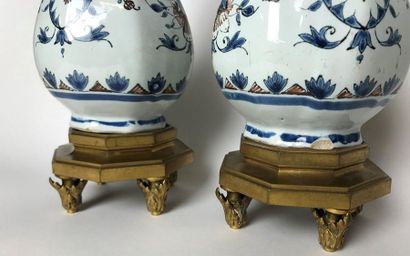 null ROUEN Pair of earthenware bottle vases with polychrome decorations with foliage,...