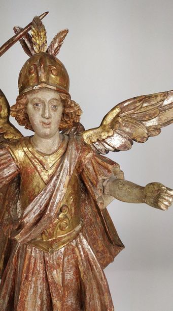 null SCULPTURE in polychrome silver and gold carved wood depicting the archangel...