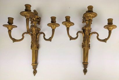null Pair of ormolu and chiselled bronze sconces with three moving light arms, the...