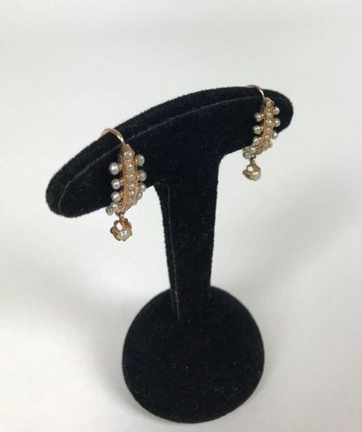 null PAIR OF EARRINGS in yellow gold set with many fine pearls, including one in...