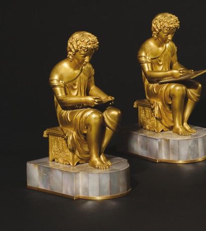 null Two gilt bronze pendant sculptures, representing children dressed in antique...