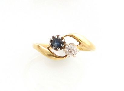 null RING YOU AND ME in 750 thousandths yellow gold decorated with a sapphire and...