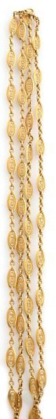 null 750-thousandths yellow gold necklace retaining a succession of geometric filigree...