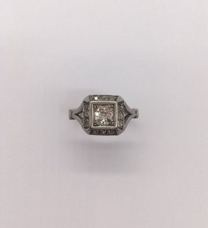 null RING 
in platinum holding one old cut diamond of about 0.50 ct in a square setting...
