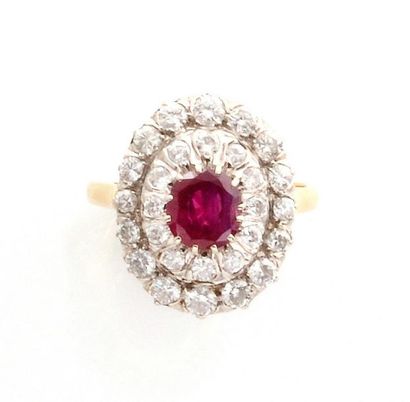 null MARQUISE RING in yellow gold holding a ruby in a double entourage of brilliant-cut...