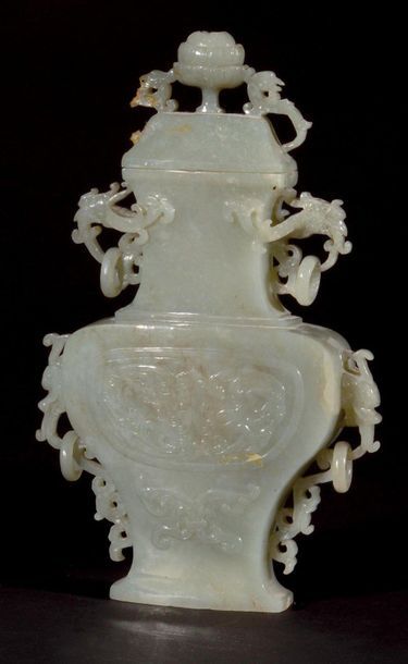 null CHINA Small covered vase in light green jade carved in the archaic style of...