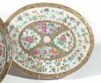 null CHINA Large circular punch bowl and oval openwork porcelain drip tray decorated...