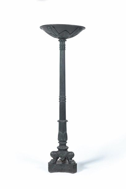 Cast iron torchere with green patina, the...
