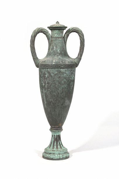 null Large oxidized bronze amphora, decorated with a Greek frieze, resting on a pedestal....