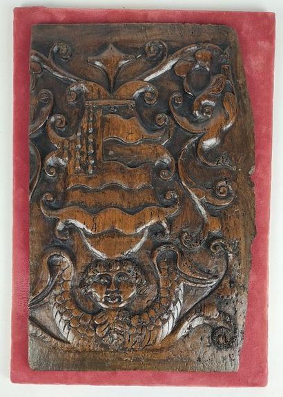 null PANEL in walnut carved in bas-relief with a coat of arms surrounded by scrolls...