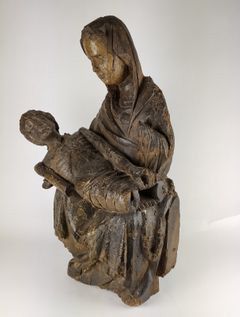 null VIRGIN OF PITIE in carved and polychromed wood, hollow back. Mary is sitting,...