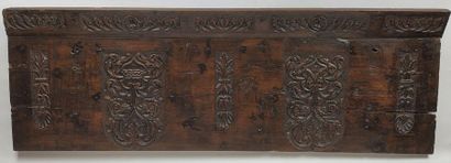 null CASE FACADE in walnut carved in bas-relief with decoration of shields and symmetrical...
