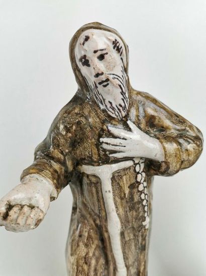 null NEVERS Figurine en faience représentant saint François en habit de moine debout...