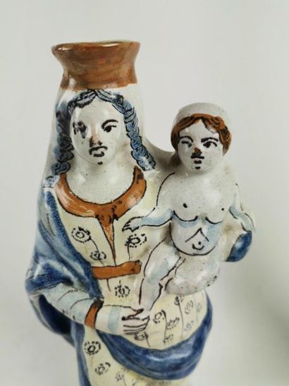 null NEVERS Three earthenware figurines representing Virgins, two of which are in...