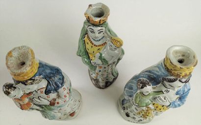 null NEVERS Three earthenware figurines depicting Virgins in labour holding the child...
