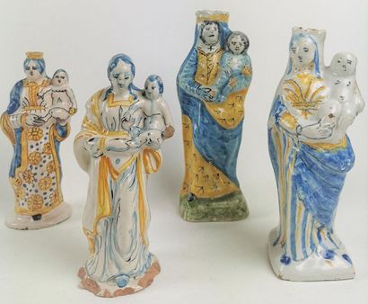 null NEVERS Four small earthenware figurines depicting Virgins, one of which is in...