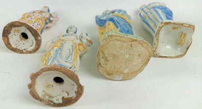null NEVERS Four small earthenware figurines depicting Virgins, one of which is in...