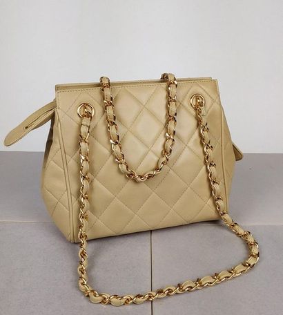 CHANEL Small shoulder bag in beige quilted...