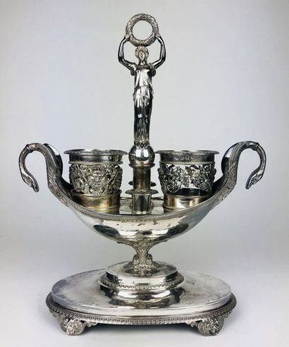  OIL-WINE HOLDER HOLDER of shuttle shape in silver chiselled with palmettes and foliage,...