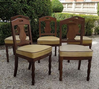 null A suite of FIVE mahogany chairs with flat openwork back and stylized decoration...