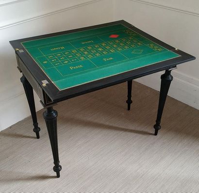 null Rectangular GAMES TABLE in blackened pearwood, decorated with brass net, tapered...