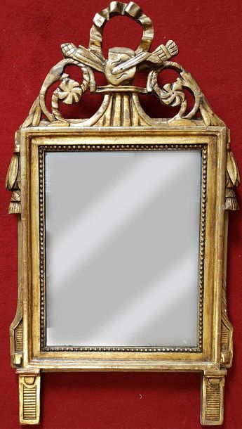 MIRROR with gilded wooden pediment. Louis...