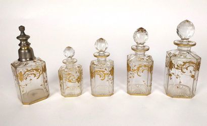  BACCARAT Crystal and gold toiletry set comprising four covered bottles and a spray...