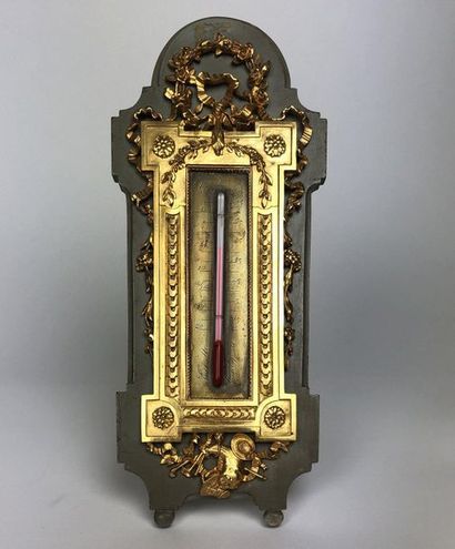  THERMOMETER in chased and gilt bronze with friezes of eggs and ribbon knots on a...