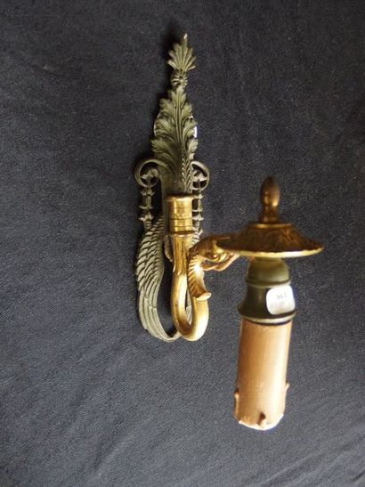 null A pair of gilt bronze Empire style swan neck sconces