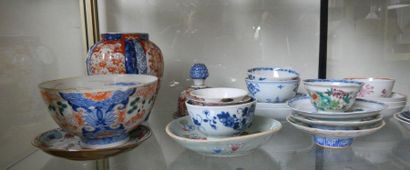 null Set including 1 Imari vase, 19 Chinese porcelain saucers, and 21 porcelain bowls....