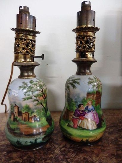 null Pair of oil lamps in the form of a baluster in painted porcelain with a gallant...