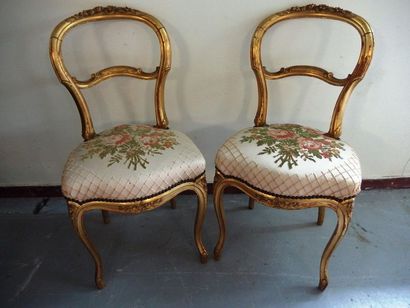 null A pair of Louis-Philippe style chairs in gilded wood.

A backrest slightly ...