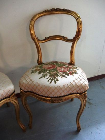 null A pair of Louis-Philippe style chairs in gilded wood.

A backrest slightly ...