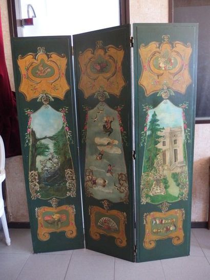 null A painted wooden screen with three leaves decorated with cherubs and exterior...