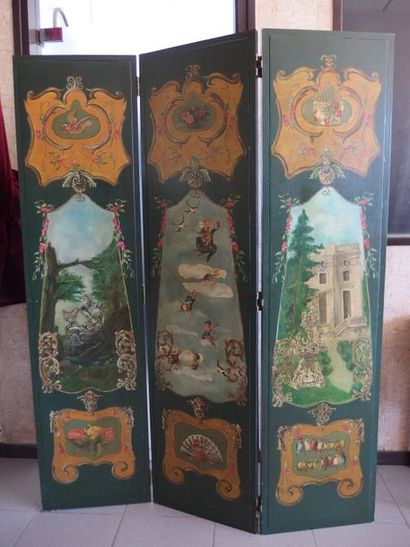 null A painted wooden screen with three leaves decorated with cherubs and exterior...