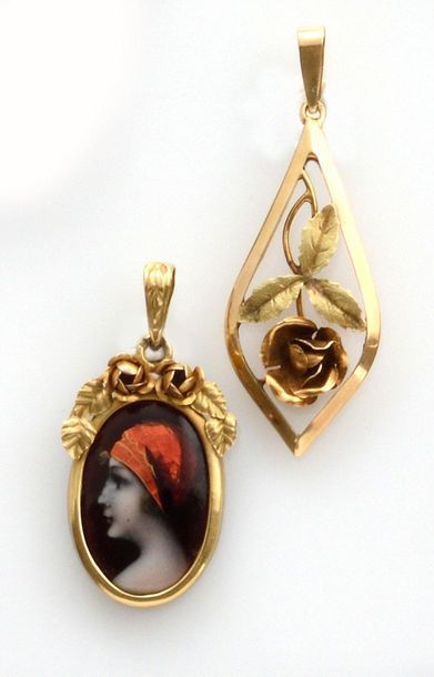 null TWO PENDANTS in 750 thousandths yellow gold, the first enamel medallion presenting...