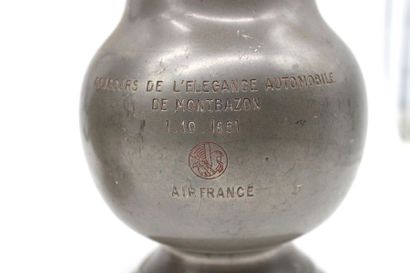 null Pair of tin pitchers

Pair of pewter pitchers, one engraved: "Concours de l'élégance...