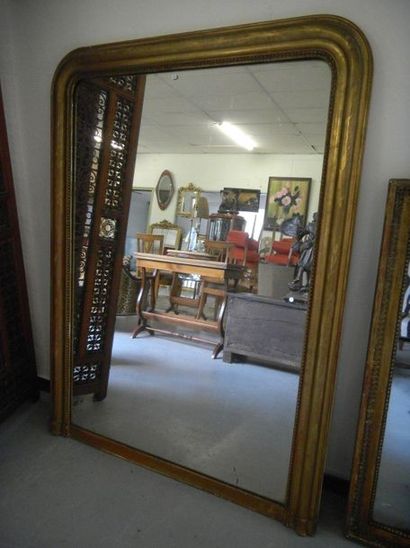 null Miroir de cheminée Louis Philippe en bois et stuc doré

140 x 105 cm