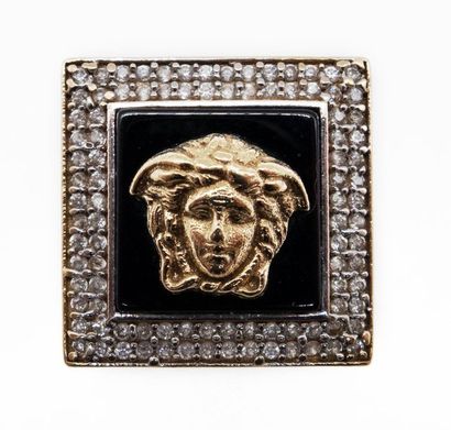 null RING in 18K yellow gold, white and black stones, with the effigy of Medusa....