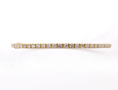 null RING BRACELET in 18K yellow gold paved with brilliant-cut diamonds. French work....