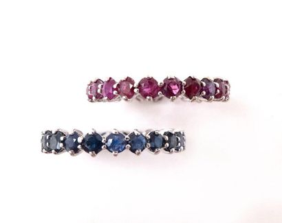 null TWO ALLIANCES in 18K white gold, one set with rubies, the second set with sapphires....