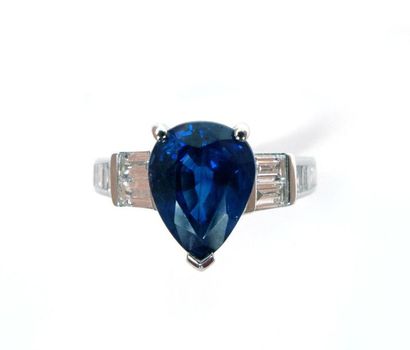 null RING in 18K white gold holding a 2.56 carat pear-shaped sapphire in a baguette...