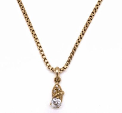 null CHAIN in 18K yellow gold with a pendant holding a white stone. French work....