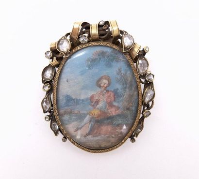 null A 17th CENTURY 18K yellow gold brooch presenting a painted miniature of a bucolic...
