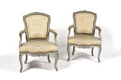 null A suite of four painted beechwood armchairs with a convertible backrest, decorated...