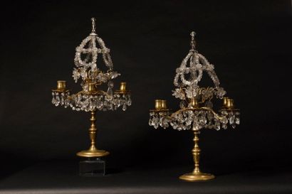 null Pair of gilt bronze girandoles with six branches of light decorated in the upper...